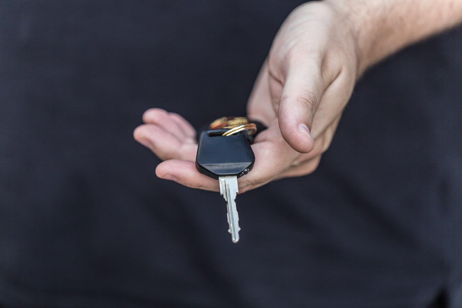 hand holding SUV keys